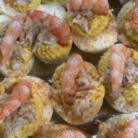 Seafood Eggs (6/Pk) · Deviled eggs topped with fresh crab meat and fresh Gulf Shrimp