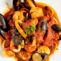 Zuppa Di Pesce · Shrimp, mussels, clams, calamari, scungilli, and scallops in. marinara sauce. Served with ch...