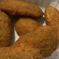 Jalapeno Poppers · Juicy jalapeno poppers breaded and filled with cheese and fried to golden perfection.