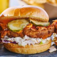 Nashville Hot Chicken Sandwich · Free Range/Halal Chicken Fillet  , Strips, or Wings on a Brioche Bun, dipped in Nashville Si...