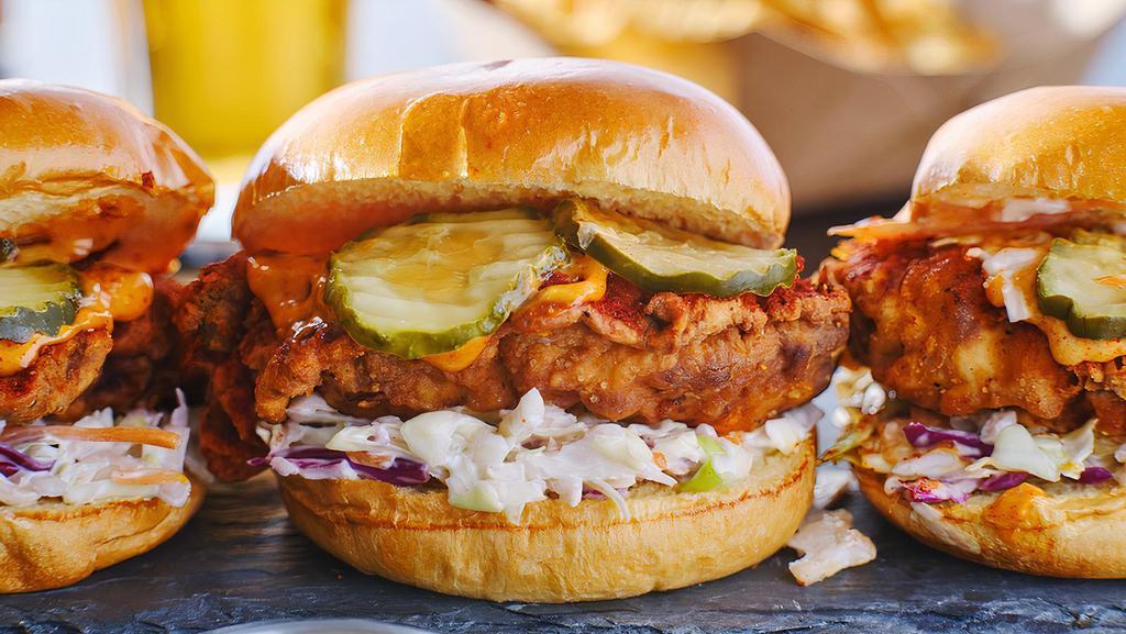 Nashville Hot Chicken Sandwich · Free Range/Halal Chicken Fillet  , Strips, or Wings on a Brioche Bun, dipped in Nashville Signature Sauce,  with your choice of toppings: Cheddar or Swiss Cheese, Bacon strips, Bacon Jam, Lettuce, Tomato, BOK secret sauce.