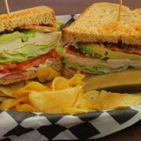 Chicken Club Sandwich · Roasted chicken, applewood smoked bacon, avocado, lettuce, tomato, onion, mayonnaise, and de...