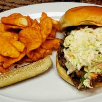 Bbq Sandwich · Pulled pork bbq, and chipotle spread topped with coleslaw, served on a potato bun. Served wi...