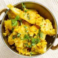 Alu Gobi Masala · Cauliflower and potatoes cooked with onions, tomatoes, and spices.