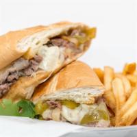 Philly Cheese Steak · Seared steak, provolone, onions and bell peppers, hoagie roll.