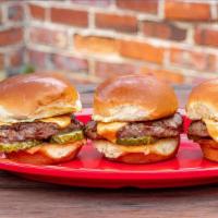 Classic Sliders · Three sliders, American cheese, pickle. 

**Consuming raw or undercooked meats, poultry, sea...