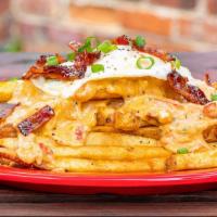 Rock Hill Poutine · Classic house-cut fries, smoked pimento, candied bacon, over easy egg and scallions.

*Consu...