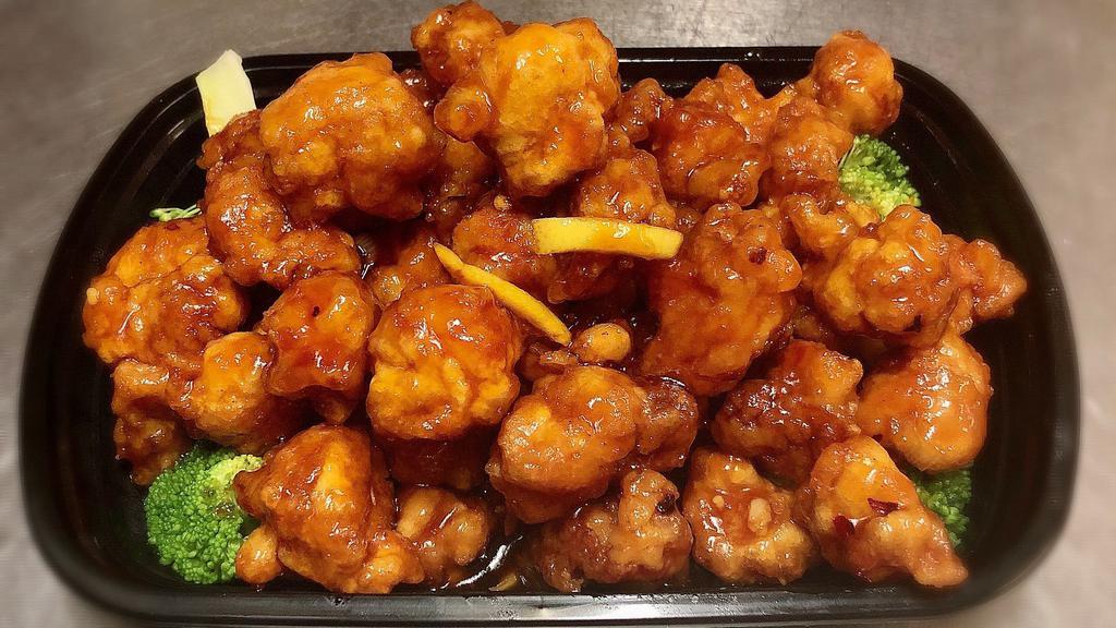 Chicken With Orange Flavor · Hot & Spicy.Crunchy chunks of chicken deep-fried until golden and marinated with delightful orange peel flavor surrounded by fresh steam broccoli.