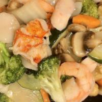 Seafood Delight · Jumbo shrimp, scallop, lobster meat, crab meat with mixed vegetables in white sauce.