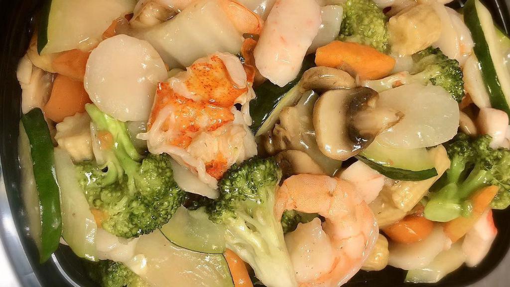 Seafood Delight · Jumbo shrimp, scallop, lobster meat, crab meat with mixed vegetables in white sauce.