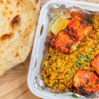 Salmon Tikka  · Salmon marinated in ginger, garlic and spices and cooked on a skewer