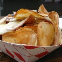 Potato Rounds · Our version of French fries: hand cut potatoes seasoned and fried for crispy skins. Served w...