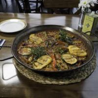 Paella De Pollo Y Verduras · Chicken and vegetables. Delivered with the paella pan. Made with bomba rice. Serves 2. Glute...