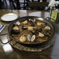 Paella De Mariscos · Shrimp, monkfish, squid, clams, and mussels. Delivered with the paella pan. Made with bomba ...