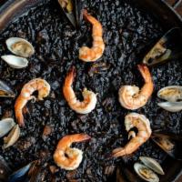 Paella Negra · Shrimp, monkfish, squid, clams, mussels, and squid ink. Delivered with the paella pan. Made ...