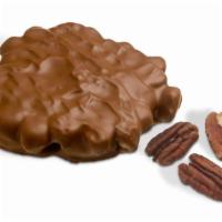 Pecan Bear · 2 Mountain-sized pieces of creamy caramel and pecans enrobed in milk or dark chocolate.