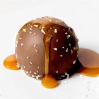 Salted Caramel Truffle · Creamy salted caramel flavored milk chocolate in a milk chocolate shell topped with sea salt.