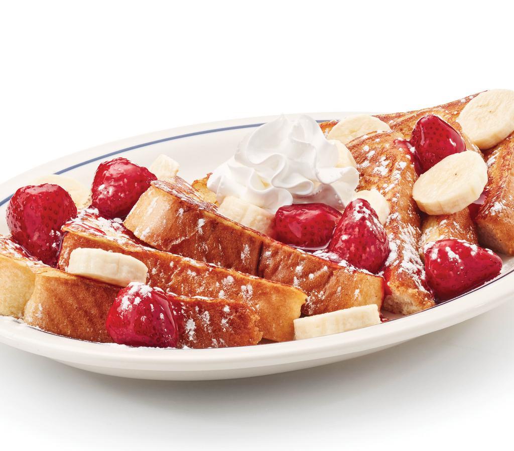Strawberry Banana French Toast · Our original French toast topped with glazed strawberries & fresh banana slices.