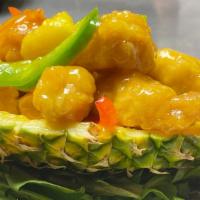 Pineapple Chicken · Crispy chicken with pineapple and bell pepper served with honey pineapple sauce. White meat.