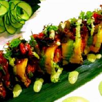 Veggie Vampire Roll · Inside tempura, asparagus sweet potato, and nagi with purple rice. Outside avocado leek with...