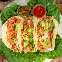 Chicken Tacos · Three tacos made with grilled taco chicken seasoned and topped with lettuce, tomatoes, onion...
