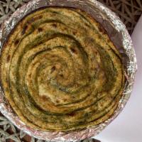 Methi Paratha · Whole wheat bread with fenugreek leaves.