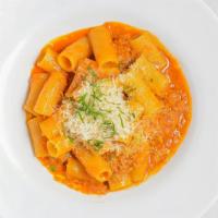 Rigatoni With Veal Bolognese · Parmigiano-Reggiano and San Marzano tomatoes.