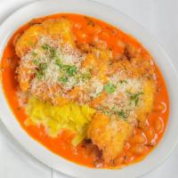 Crispy Chicken Over Pasta Fagioli · Buttered noodles, Parmigiano-Reggiano, fresh herbs and Tuscan olive oil.