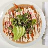 Chilaquiles · Plant based. Gluten free.
Baked tortillas, home made red sauce,  house cashew crema, red oni...