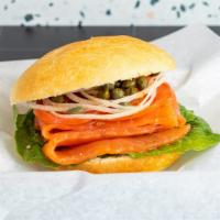 Lox Sandwich · Smoked salmon served on toasted bagel with cream cheese, lettuce, tomatoes, onions, capers, ...