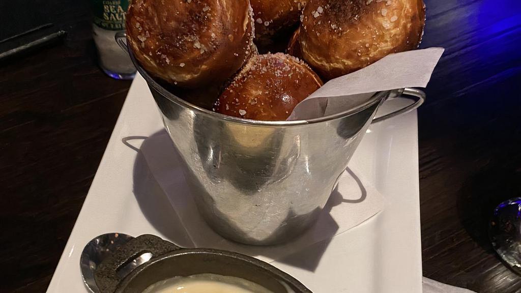 Pretzel Bites · Made in Texas. Warm sea salt pretzel bites served with cheese fondue. Add honey clover for an additional charge.