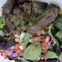 South Texas Steak Salad · Made in Texas. Mixed greens, tomatoes, black bean corn relish, avocado, creamy cilantro, gri...