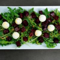 Goat Busters Salad · Beets, arugula, sunflower seeds, and Natural Goat Cheese with Chivata's vinaigrette.