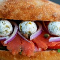 Row Your Goat · Ciabatta bread filled with arugula, tomatoes, red onions, smoked salmon, and Capers Goat Che...