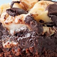 Rocky Road Brownies · Rich chocolate brownie topped with chopped walnuts, semi-sweet chocolate chips, peanut butte...