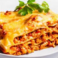 Meat Lasagna · Our house made lasagna noodles layered with a blend of 3 cheeses and meat sauce with melted ...