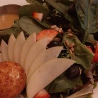 Goat Cheese Salad · Gluten free. Mixed Greens, Fried Goat Cheese, Seasonal Fruit, Toasted Sunflower Seeds, Citru...