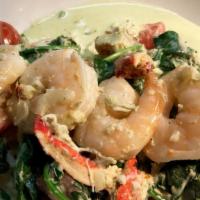 Seafood Linguine · Lobster, Shrimp and Crab in a tarragon-lobster cream sauce, spinach, and tomatoes, homemade ...