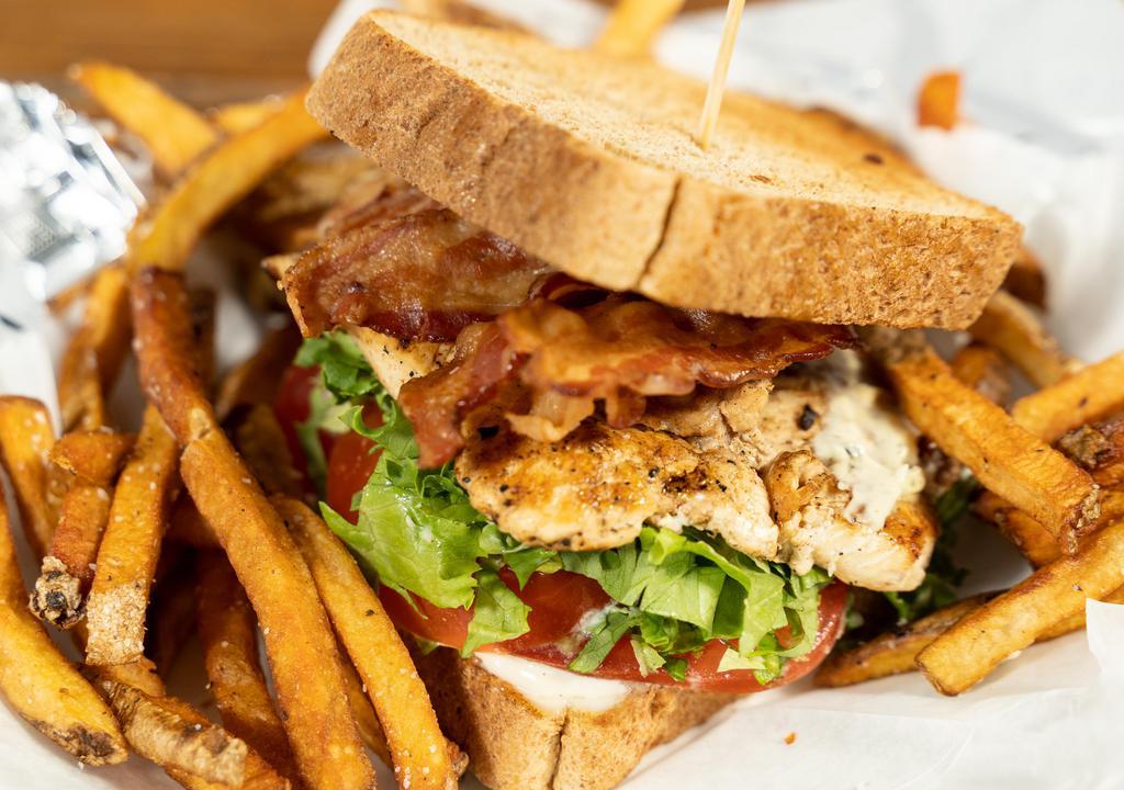 Wholly Club · Marinated chicken breast sliced thin, stacked with bacon, tomatoes, lettuce, and mayo on Whole Wheat Texas Toast.