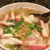 Wonton Soup · Wonton dumpling in clear broth, garnished with bean sprouts, garlic, and cilantro.