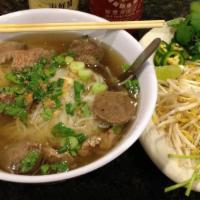 Pho (Beef) · Savory beef broth served with sliced beef flank, beef meatballs, thin rice noodles, onions, ...