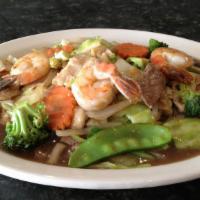 Pad Three Delight · Stir-fried chicken, beef, and shrimp with snow peas, broccoli, mushrooms, carrots, bamboo sh...