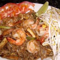 Pad Thai · Traditional stir-fried rice noodles cooked with tofu, green onions, egg, and bean sprouts, s...