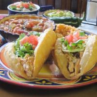 Puffy Taco Plate · Two puffy tacos of your choice, topped with lettuce and tomato, served with your choice of b...