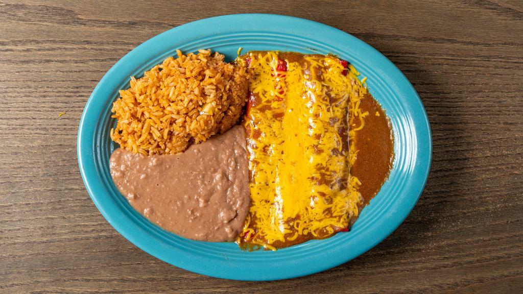 Cheese Enchilada Dinner (2) · Cheese enchiladas filled with cheddar cheese topped with traditional homemade ancho  chile tex mex sauce. Served with rice and choice of beans.