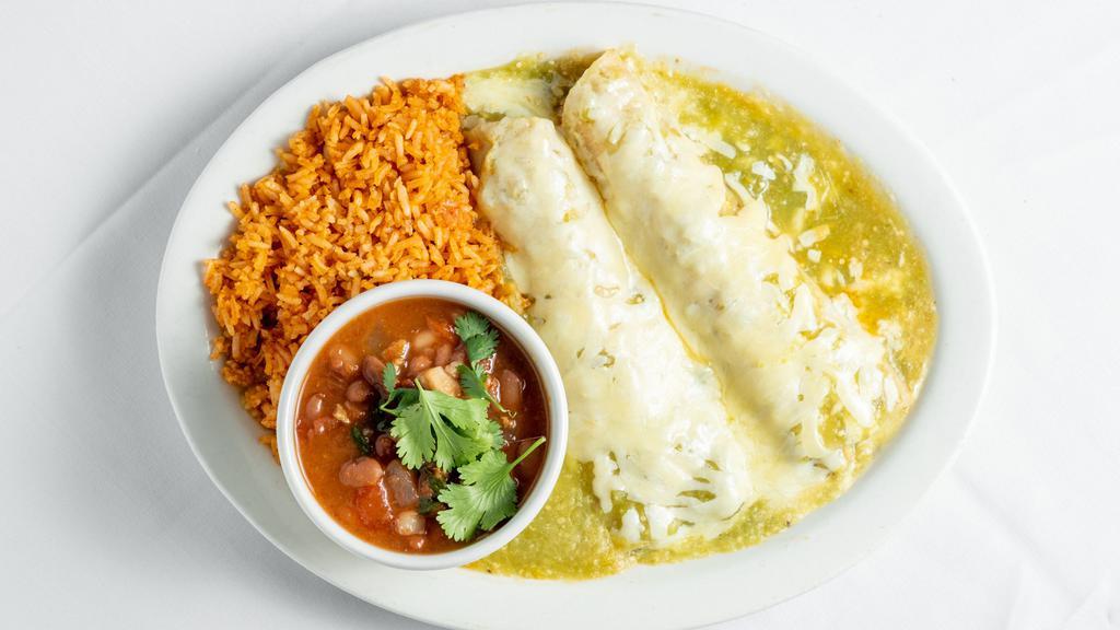 Chicken Enchiladas Verdes (2) · Shredded chicken rolled in a white corn tortilla, topped with tomatillo sauce and melted monterrey jack cheese, sour cream, served with spanish rice and choice of beans and two tortillas on the side.