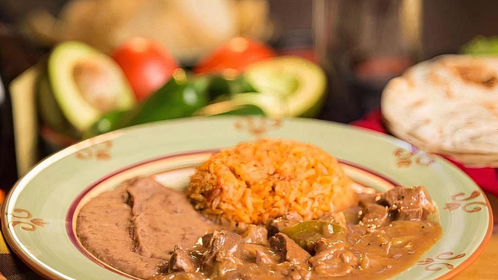 Carne Guisada Plate · Mexican beef stew meat in brown gravy.