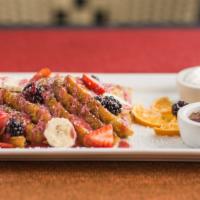 Classic French Toast (Gluten Free) · Vegan & Gluten free. Served with banana, seasonal berries, powdered sugar &  agave on the si...
