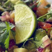 Ceviche · Shrimp lightly seasoned in lime juice and garnished with tomatoes, mild peppers, onions and ...