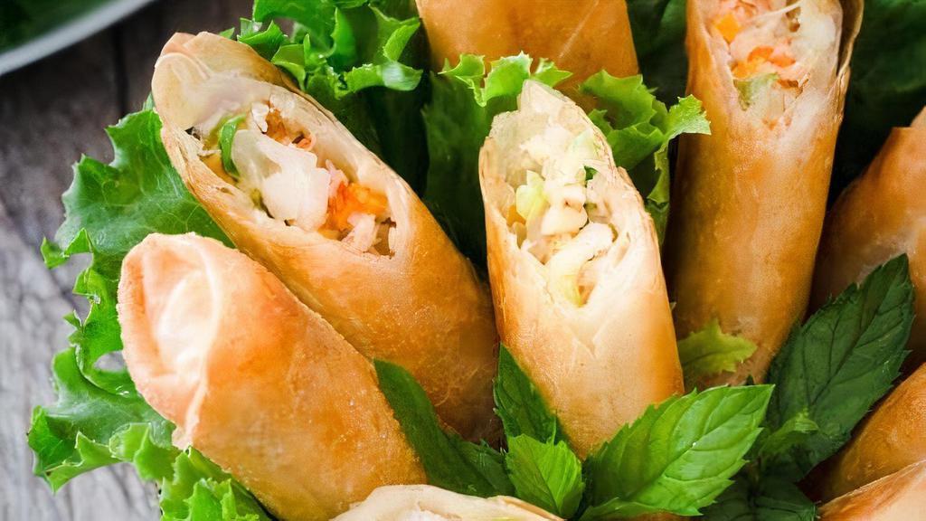 Large Vn Spring Rolls (6) · The Large Vietnamese Fried Spring Rolls have pork, taro, carrot, glass noodle, onion, and wood-ear mushroom inside.
It is cut into 8 pieces.
Served with fish sauce
